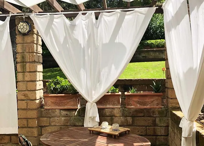 Апартаменты Confortevole Bilocale Giardino Doppio Parcheggio *